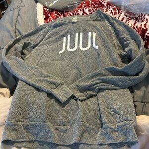 Grey sweatshirt that says Jvvl. Sized medium.
